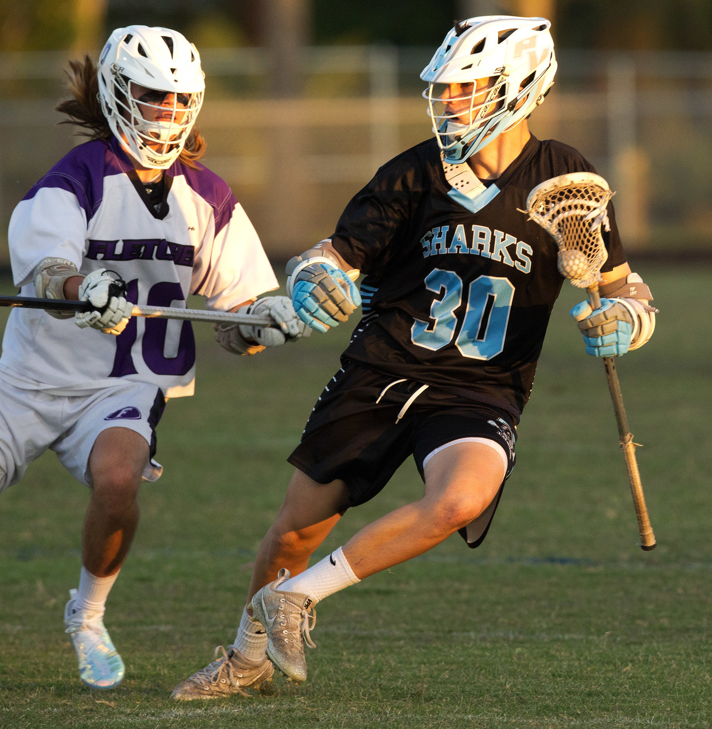 Patrick Dotsikas makes a move against a defender in the Sharks’ 21-4 win over Fletcher on Friday, April 27.